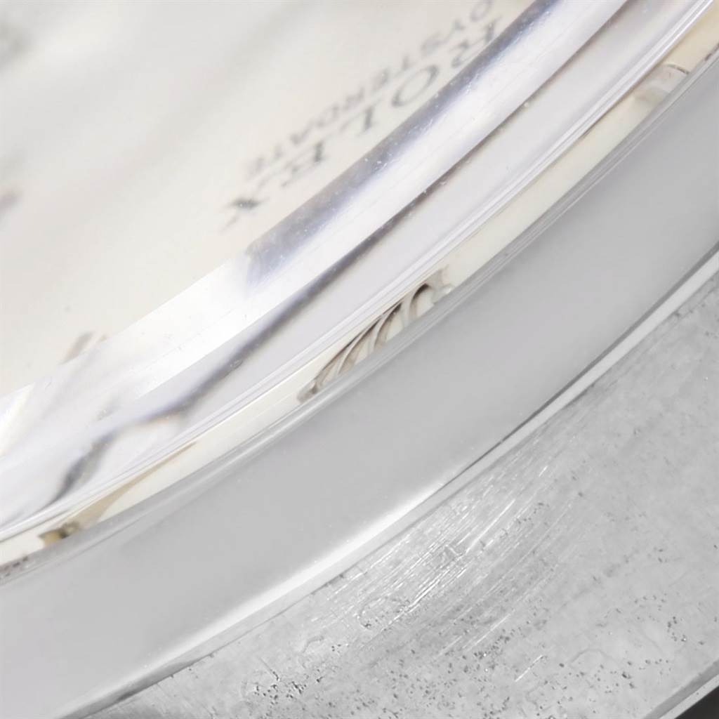 The image shows a close-up of the side of the Rolex Vintage Collection 6694 Men's Stainless Steel Silver Dial 6694 Men's Stainless Steel Silver Dial model watch case and crystal.