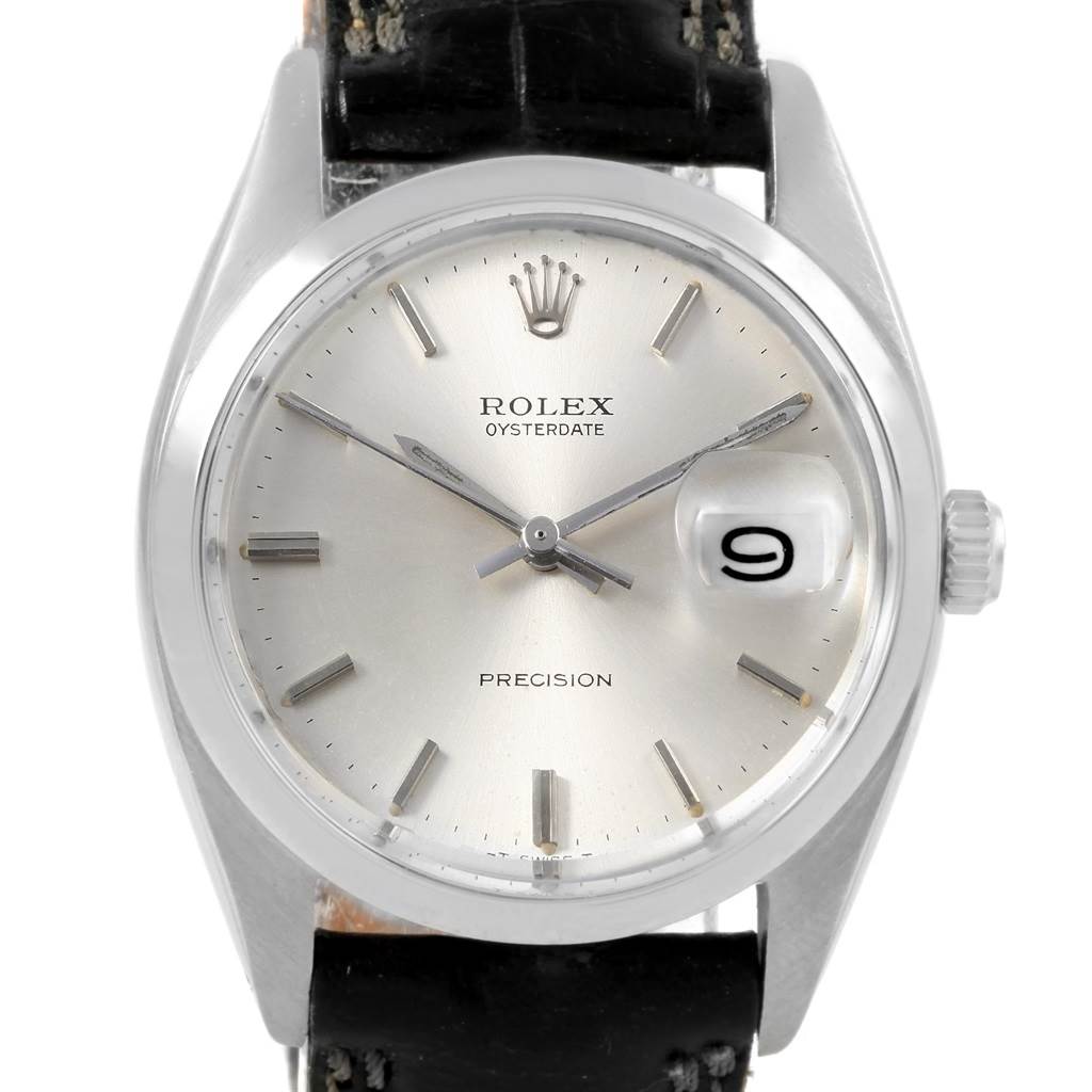 The image shows a front view of the Vintage Collection Rolex Oysterdate watch, featuring the dial, hands, and part of the strap.