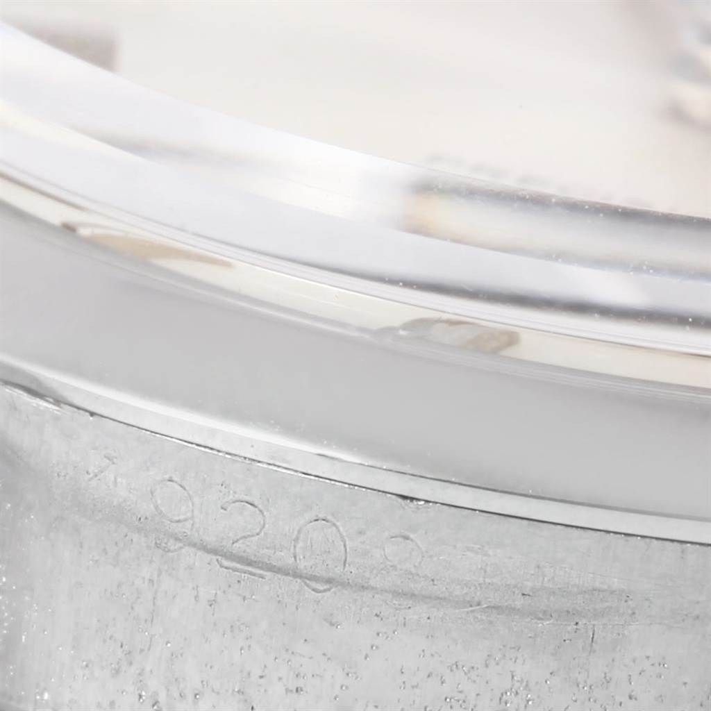 This close-up image of the Rolex Vintage Collection 6694 Men's Stainless Steel Silver Dial 6694 Men's Stainless Steel Silver Dial watch shows the side of the case, serial number, and part of the crystal.
