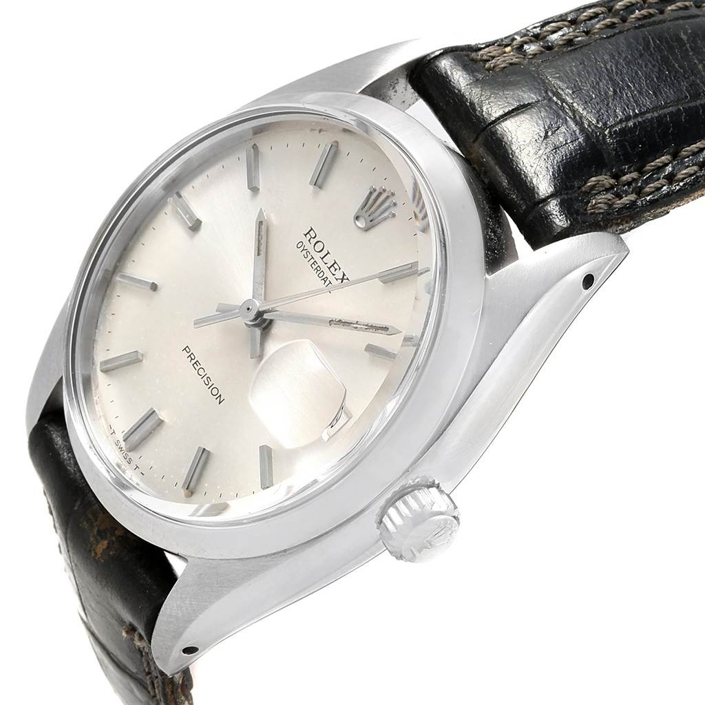 The image shows a side angle view of the Rolex Vintage Collection 6694 Men's Stainless Steel Silver Dial 6694 Men's Stainless Steel Silver Dial watch displaying its face, bezel, crown, and leather strap.