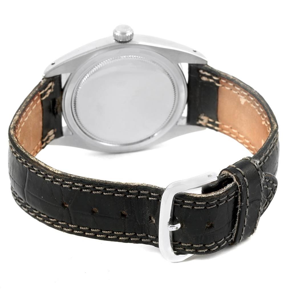 This image shows the back of a Rolex Vintage Collection 6694 Men's Stainless Steel Silver Dial 6694 Men's Stainless Steel Silver Dial watch and its leather strap with buckle.