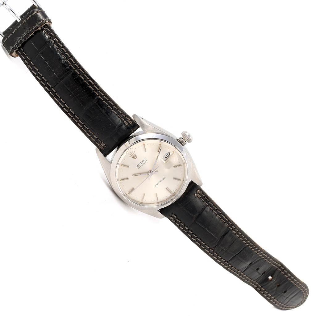 The Rolex Vintage Collection 6694 Men's Stainless Steel Silver Dial 6694 Men's Stainless Steel Silver Dial watch is shown at an angled top-down view, displaying the face, bezel, crown, and leather strap.