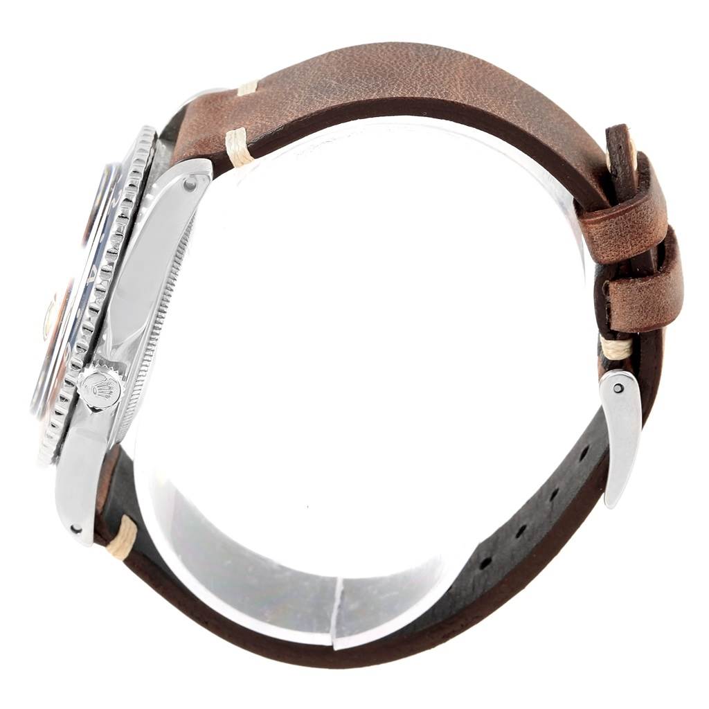 The image shows a side view of a Rolex Vintage Collection 1675 Men's Stainless Steel Black Dial 1675 Men's Stainless Steel Black Dial watch, highlighting the case, bezel, crown, and leather strap.