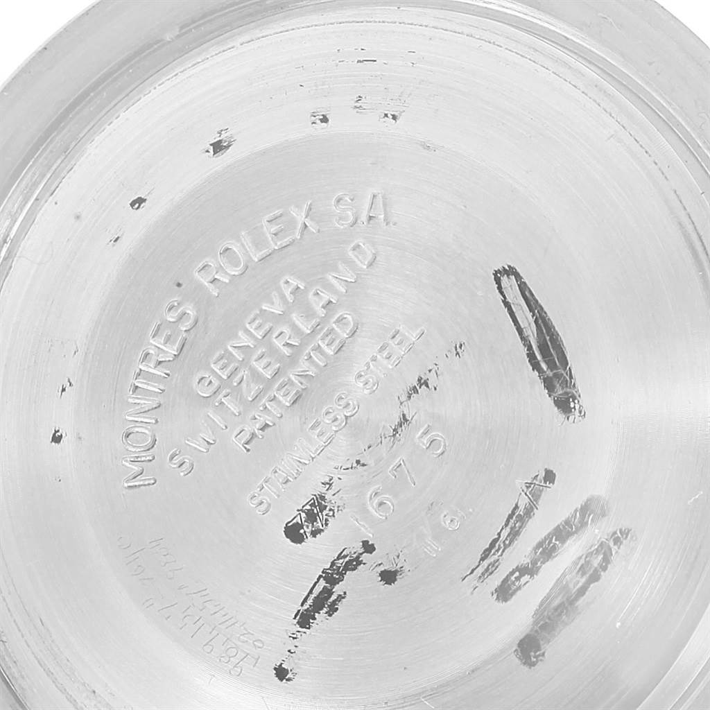 The image shows the inside case back of a Vintage Collection Rolex watch, engraved with model and brand information.