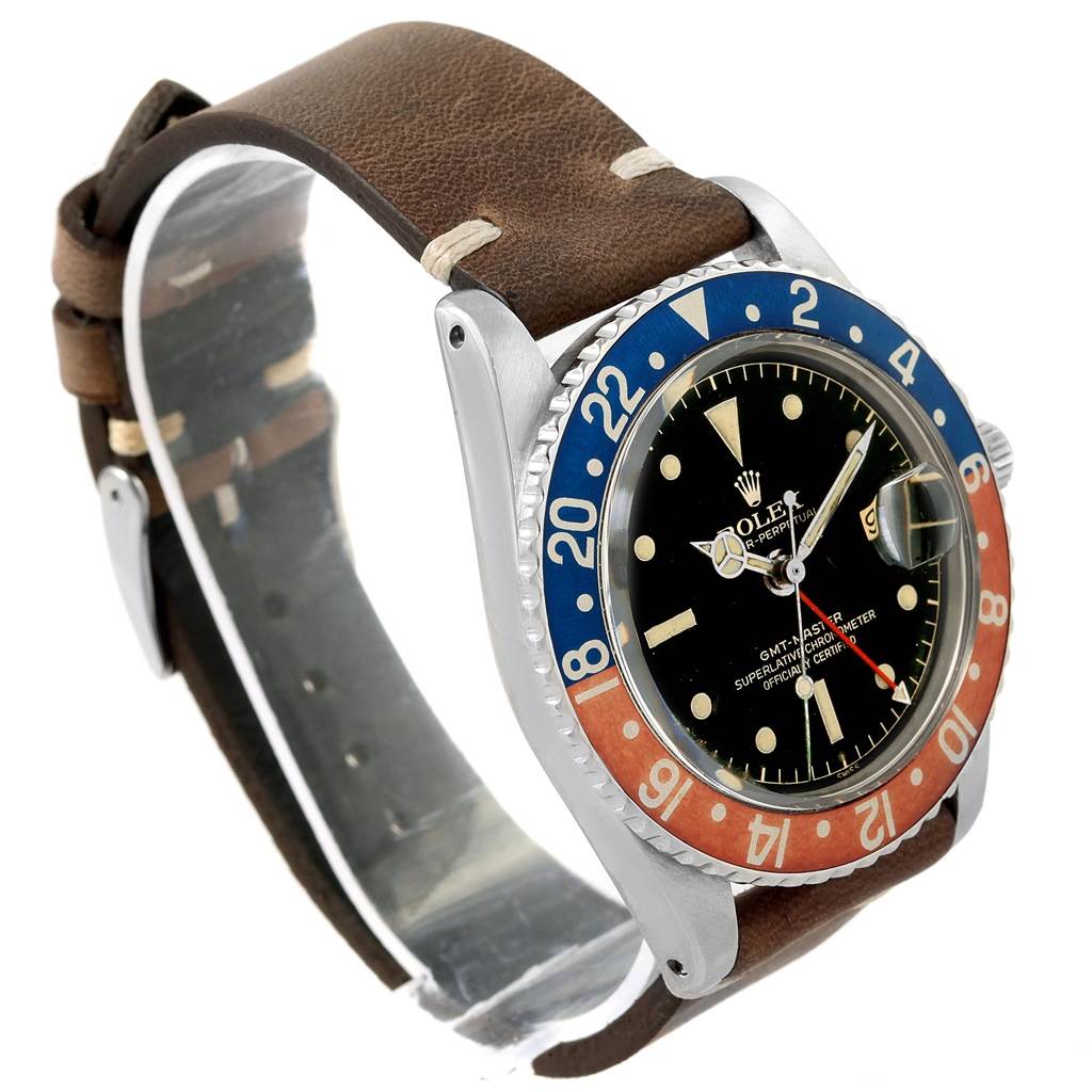 This side angle shows the face, bezel, crown, and leather strap of the Rolex Vintage Collection 1675 Men's Stainless Steel Black Dial 1675 Men's Stainless Steel Black Dial watch.