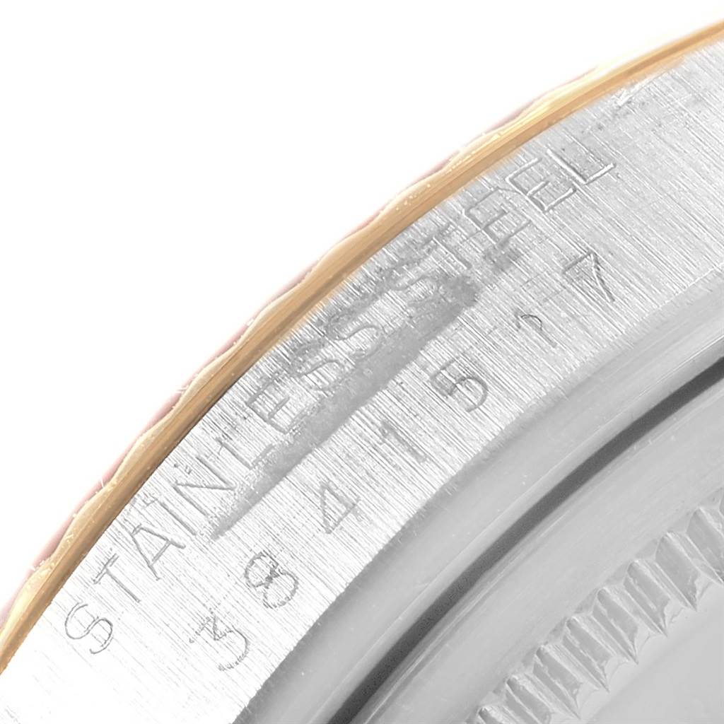 This close-up angle shows the side and engraving details of the Rolex Vintage Collection 1601 Men's Steel and Gold (two tone) Blue Dial 1601 Men's Steel and Gold (two tone) Blue Dial model's stainless steel case.