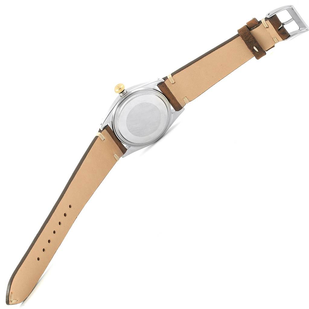 This image shows the back view of the Rolex Vintage Collection 1601 Men's Steel and Gold (two tone) Blue Dial 1601 Men's Steel and Gold (two tone) Blue Dial watch, highlighting its case back and leather strap.