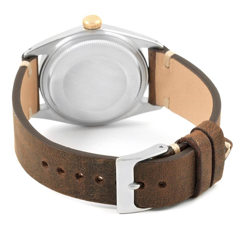 The image shows the back casing, crown, and leather strap of the Rolex Vintage Collection 1601 Men's Steel and Gold (two tone) Blue Dial 1601 Men's Steel and Gold (two tone) Blue Dial model watch.