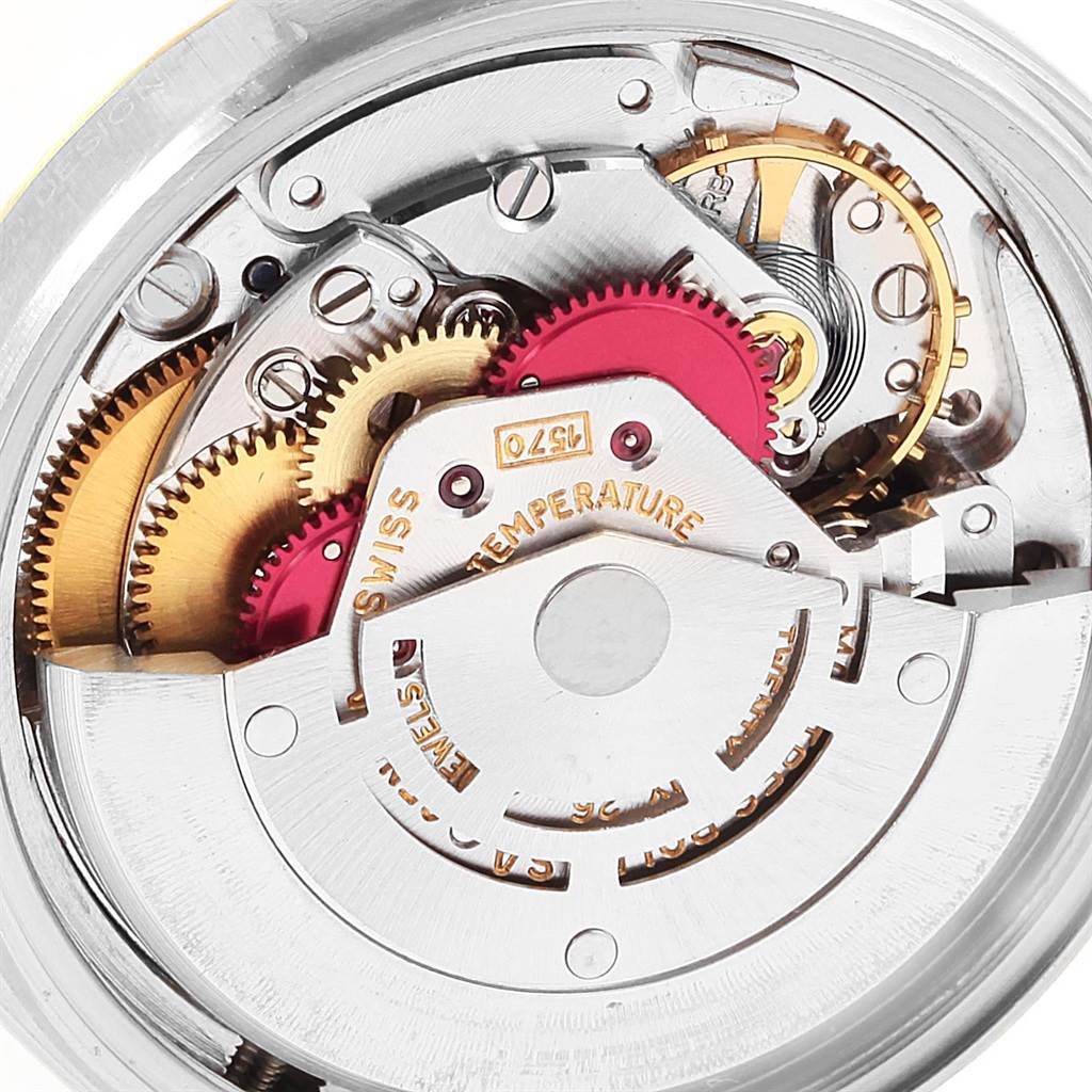 This image shows the intricate internal mechanism of the Rolex Vintage Collection 1601 Men's Steel and Gold (two tone) Blue Dial 1601 Men's Steel and Gold (two tone) Blue Dial model, highlighting gears and components.