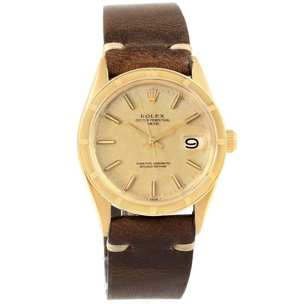 This image shows a frontal view of a Rolex Vintage Collection 1501 Men's Yellow Gold Champagne Dial 1501 Men's Yellow Gold Champagne Dial watch with a gold case, brown leather strap, and date display.
