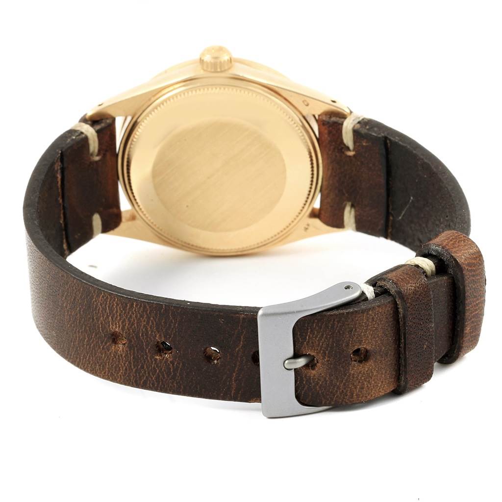 This Rolex Vintage Collection 1501 Men's Yellow Gold Champagne Dial 1501 Men's Yellow Gold Champagne Dial watch image shows the back case and the brown leather strap with a silver buckle, viewed from the rear.