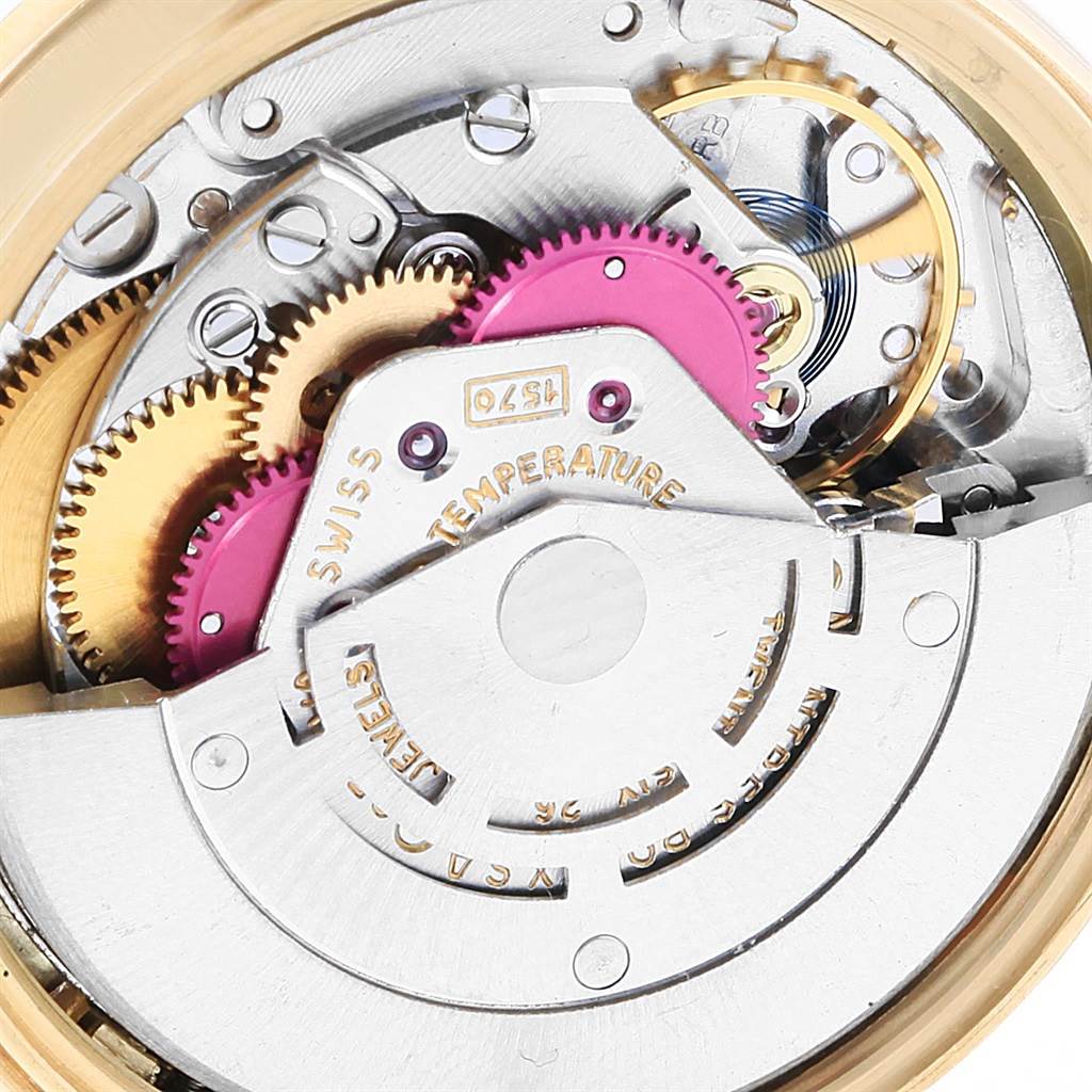 Close-up view of the Rolex Vintage Collection 1501 Men's Yellow Gold Champagne Dial 1501 Men's Yellow Gold Champagne Dial watch's internal mechanism, showing gears and intricate parts.