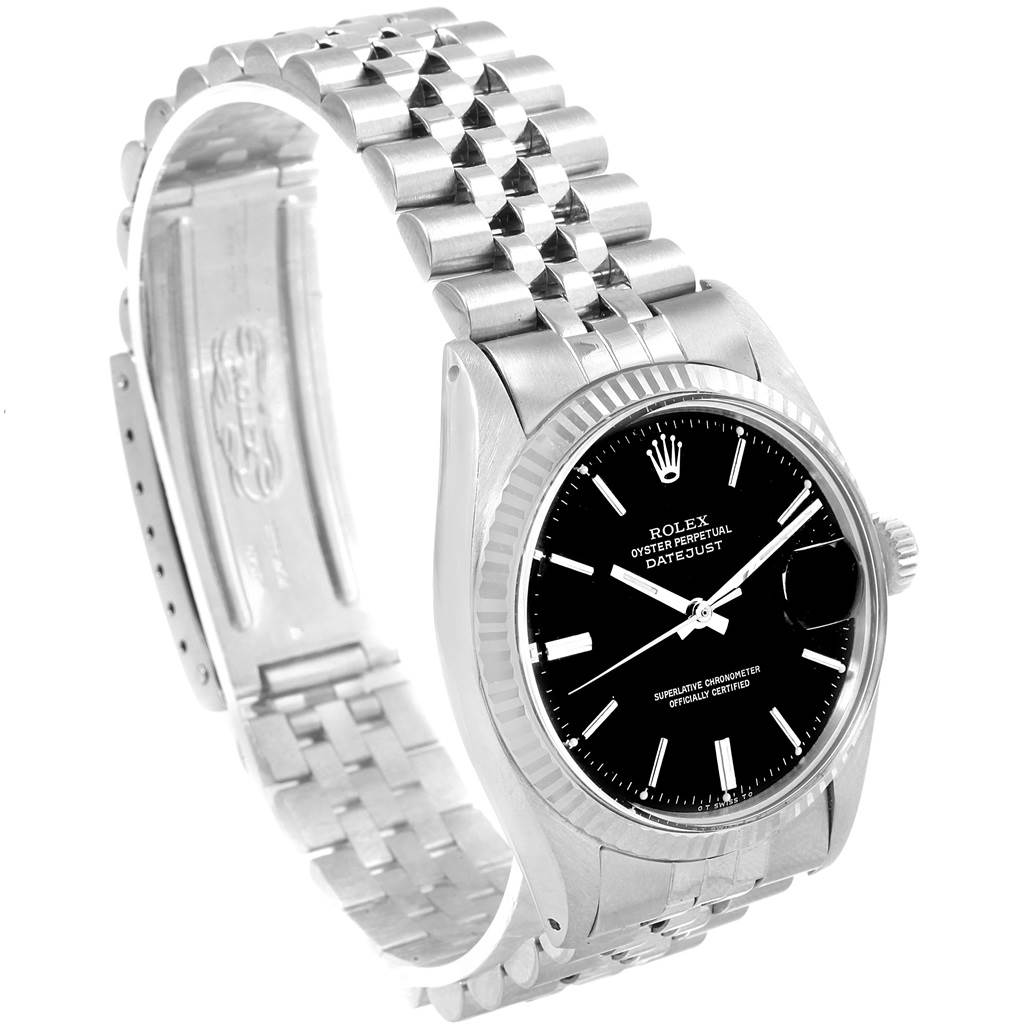 The image shows a Rolex Vintage Collection 1601 Men's Stainless Steel Black Dial 1601 Men's Stainless Steel Black Dial watch at an angle emphasizing its black dial, fluted bezel, and Jubilee bracelet.