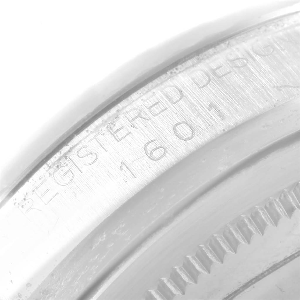 This image shows a close-up of the engraved serial number on the case back of a Rolex Vintage Collection 1601 Men's Stainless Steel Black Dial 1601 Men's Stainless Steel Black Dial model watch.