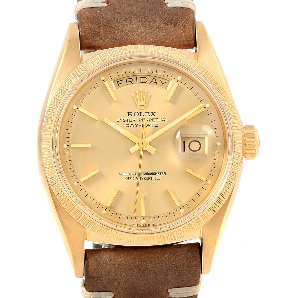 This image shows a frontal view of a Rolex Vintage Collection 1807 Men's Yellow Gold Champagne Dial 1807 Men's Yellow Gold Champagne Dial Oyster Perpetual Day-Date watch with a gold case and brown leather strap.