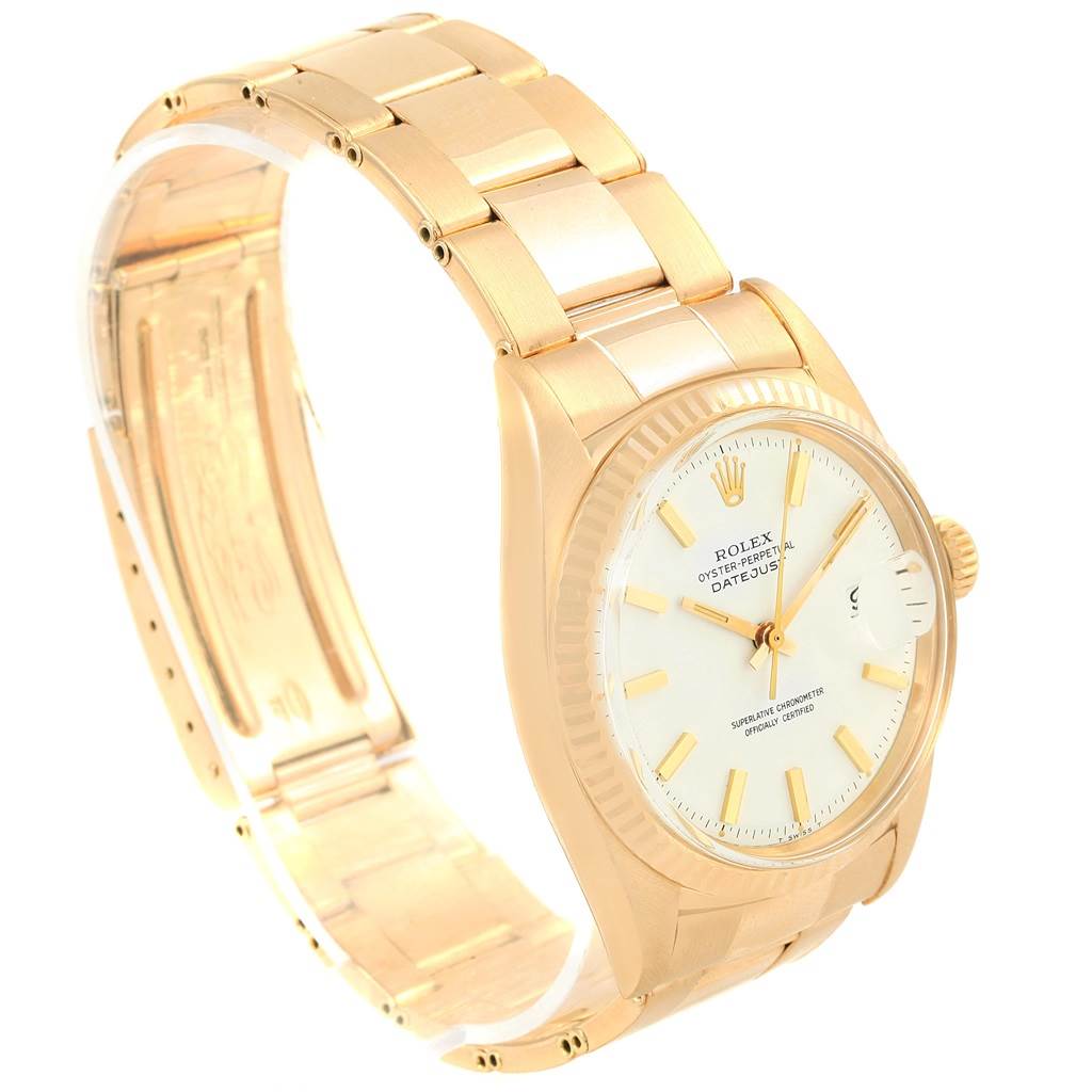 This image shows a side view of the Rolex Vintage Collection 1601 Men's Yellow Gold White Dial 1601 Men's Yellow Gold White Dial model, highlighting the gold bracelet, dial, and crown.