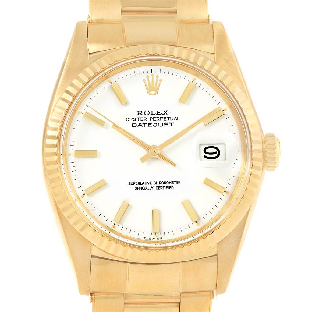 The image shows a front view of the Rolex Vintage Collection 1601 Men's Yellow Gold White Dial 1601 Men's Yellow Gold White Dial Datejust watch, featuring its dial, hands, date window, and part of the bracelet.