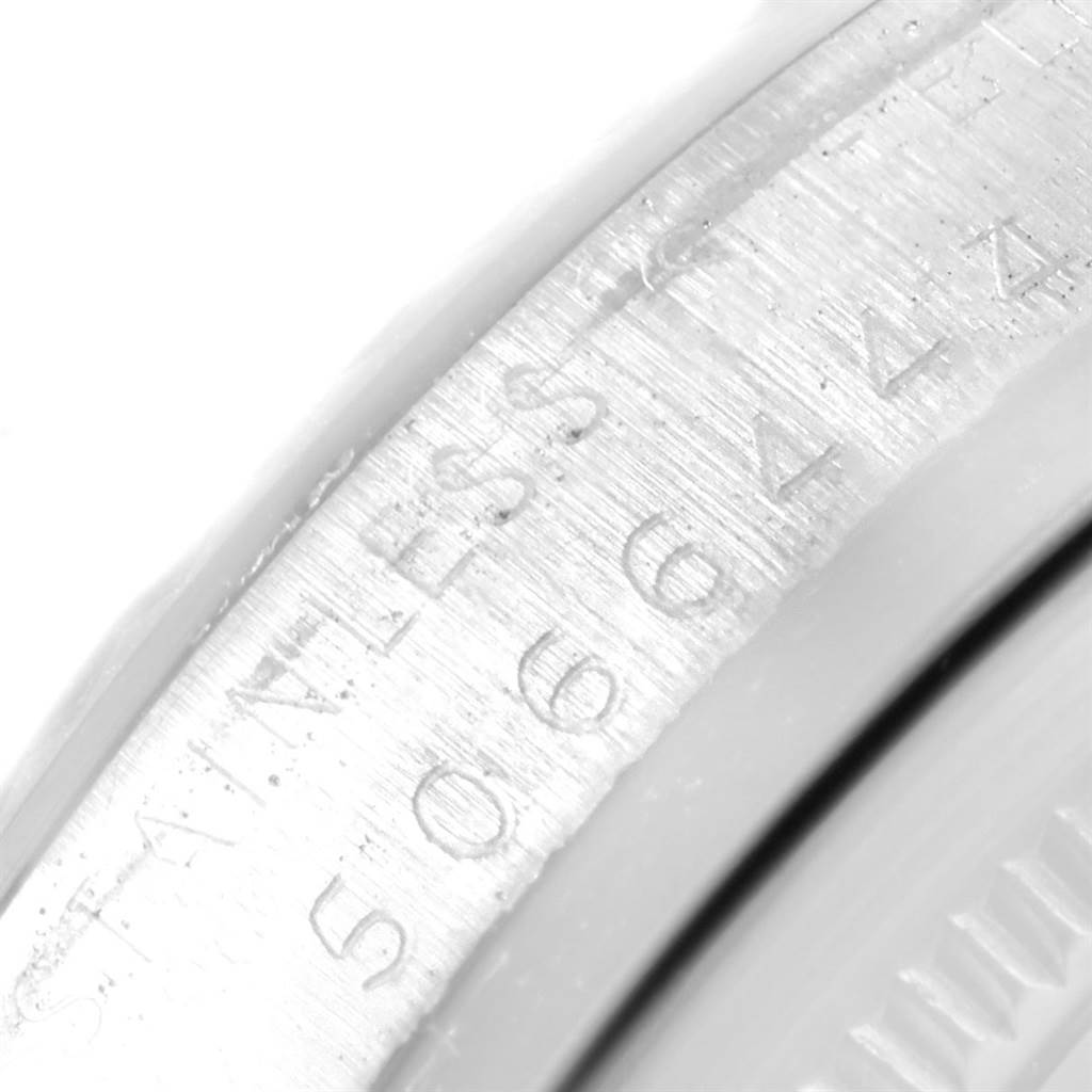 This is a close-up of the serial number and "STAINLESS" engraving on the caseback edge of the Rolex Vintage Collection 1601 Men's Stainless Steel Black Dial 1601 Men's Stainless Steel Black Dial watch.