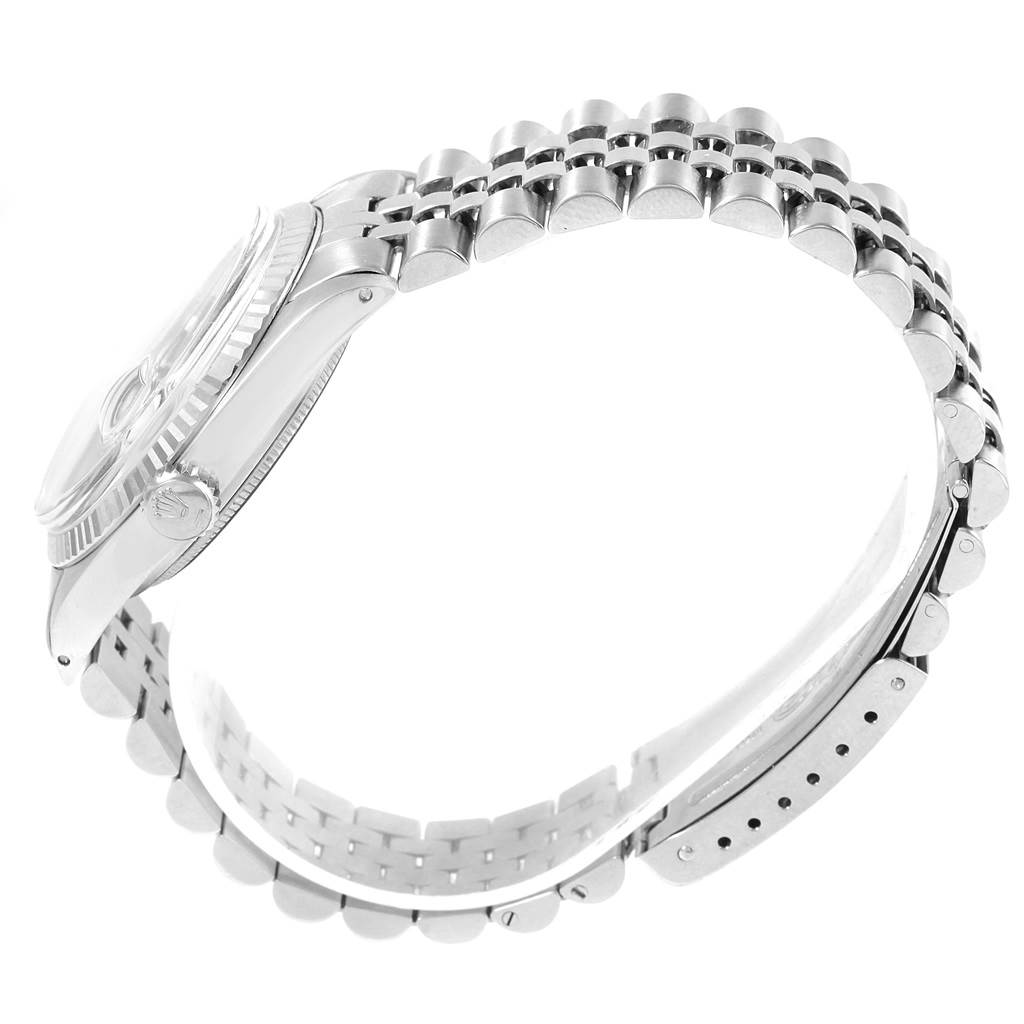 The image shows a side view of the Rolex Vintage Collection 1601 Men's Stainless Steel Black Dial 1601 Men's Stainless Steel Black Dial model watch, highlighting its bracelet and crown.