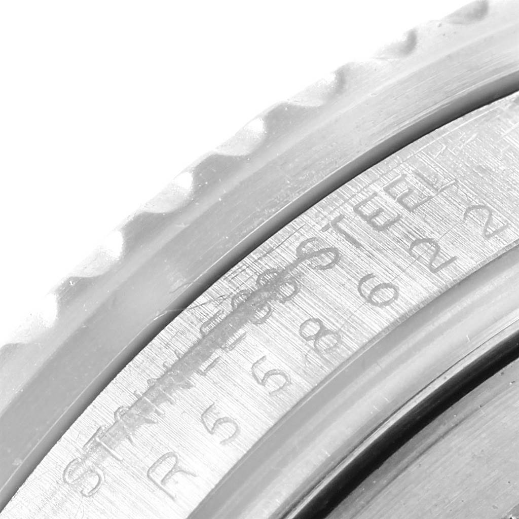 The image shows a close-up of the bezel and part of the case with the engraving for the Vintage Collection model by Rolex.