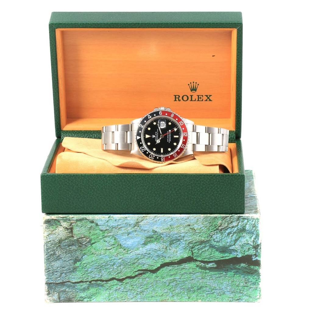 The Rolex Vintage Collection 16760 Men's Stainless Steel Black Dial 16760 Men's Stainless Steel Black Dial watch is displayed front-facing in an open green and orange box.