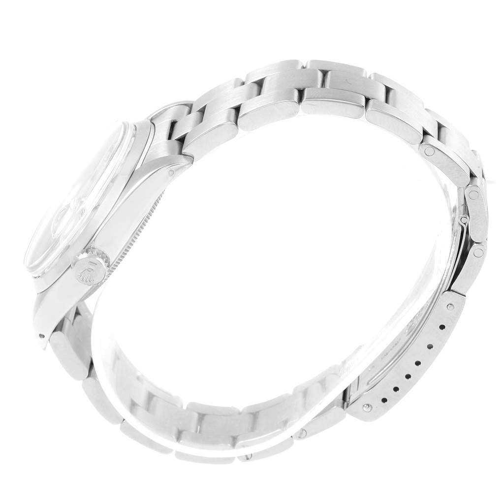 This side angle shows the bracelet, bezel, and crown of the Rolex Vintage Collection 1500 Men's Stainless Steel Silver Dial 1500 Men's Stainless Steel Silver Dial watch.