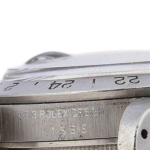 The image shows the side angle of a Rolex Vintage Collection 1655 Men's Stainless Steel Black Dial 1655 Men's Stainless Steel Black Dial model, displaying the bezel, case, and part of the crown.