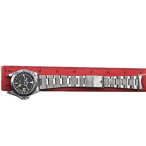 The image shows a side view of the Rolex Vintage Collection 1655 Men's Stainless Steel Black Dial 1655 Men's Stainless Steel Black Dial watch, displaying its face, bezel, bracelet, and clasp next to a ruler.