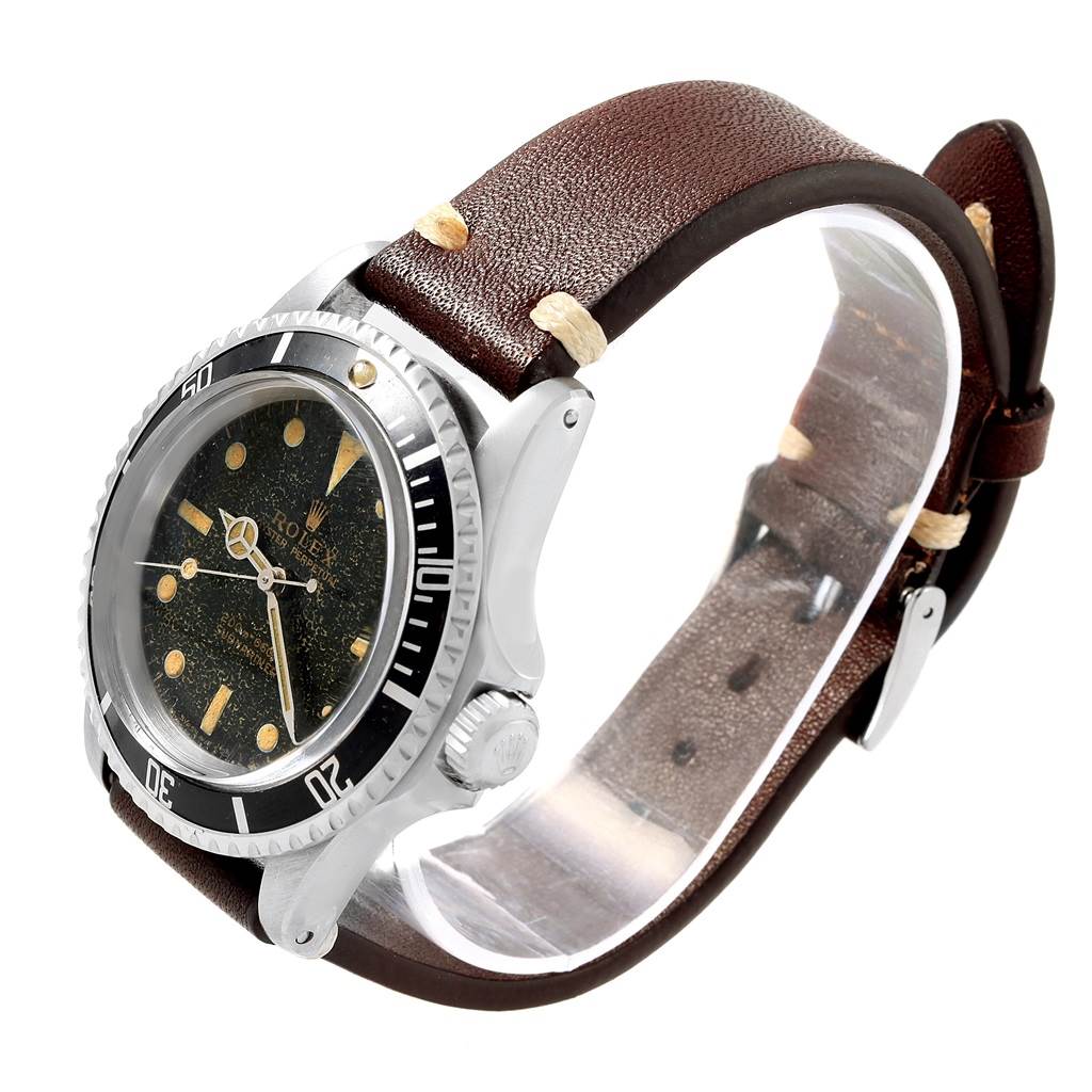 The Rolex Vintage Collection 5513 Men's Stainless Steel Black Dial 5513 Men's Stainless Steel Black Dial model watch is shown at an angle highlighting the dial, bezel, case, crown, and brown leather strap.
