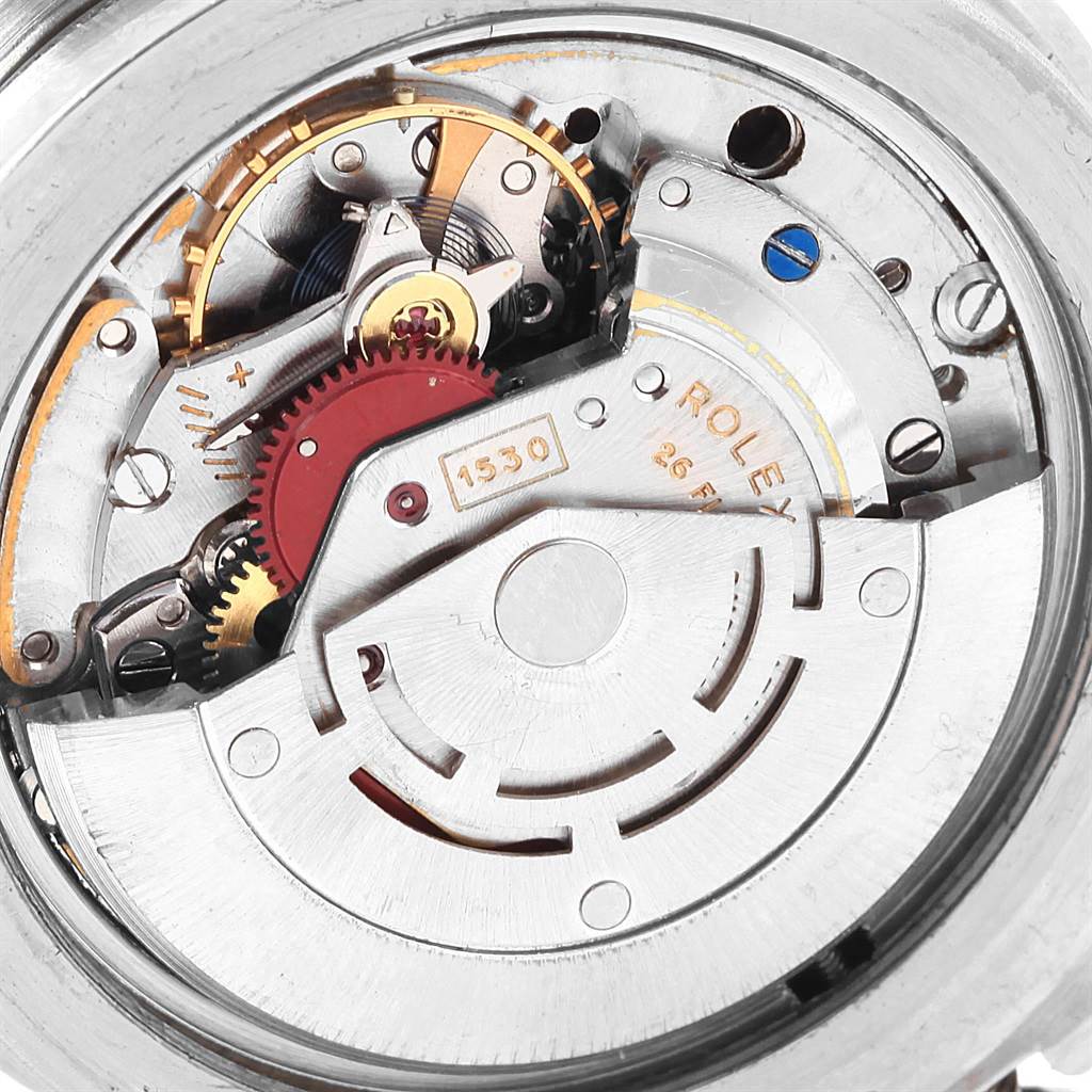 The image shows the inner mechanical movement of a Vintage Collection Rolex watch from a top-down angle.