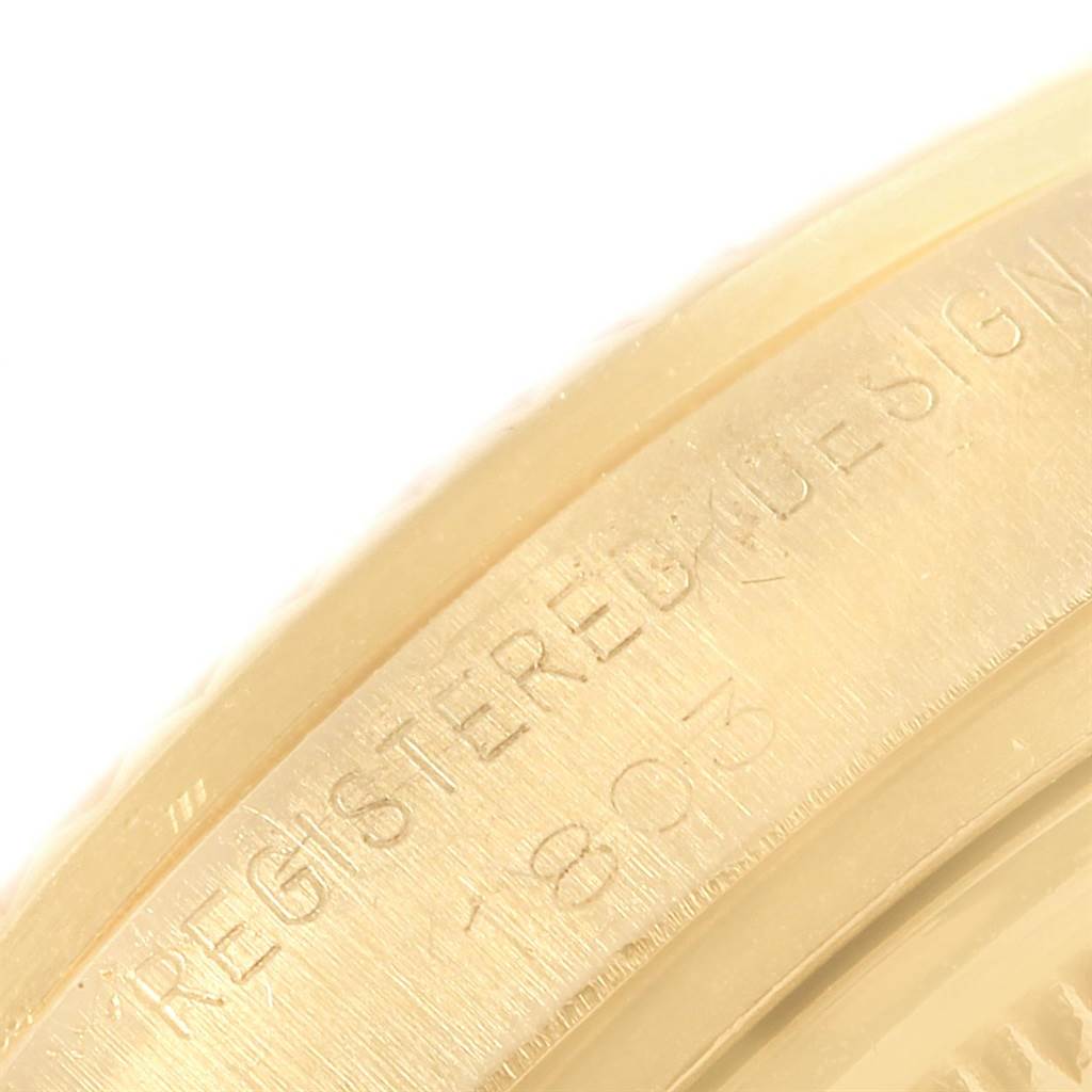 This close-up image shows the engraved side of the bezel or caseback of the Rolex Vintage Collection 1803 Men's Yellow Gold Silver Dial 1803 Men's Yellow Gold Silver Dial model.