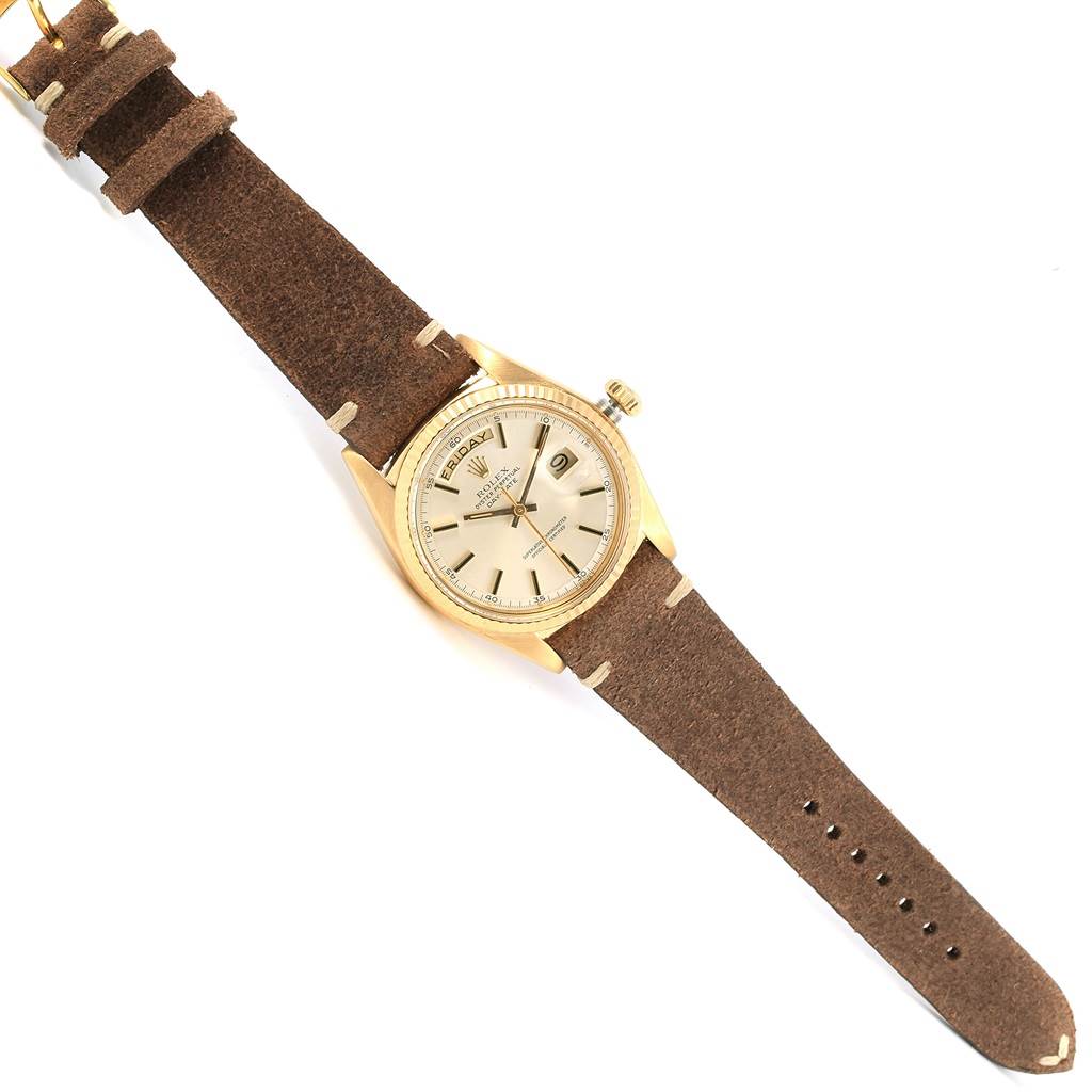 The Rolex Vintage Collection 1803 Men's Yellow Gold Silver Dial 1803 Men's Yellow Gold Silver Dial watch is shown at a top-down angle, displaying the face, bezel, crown, and brown leather strap.