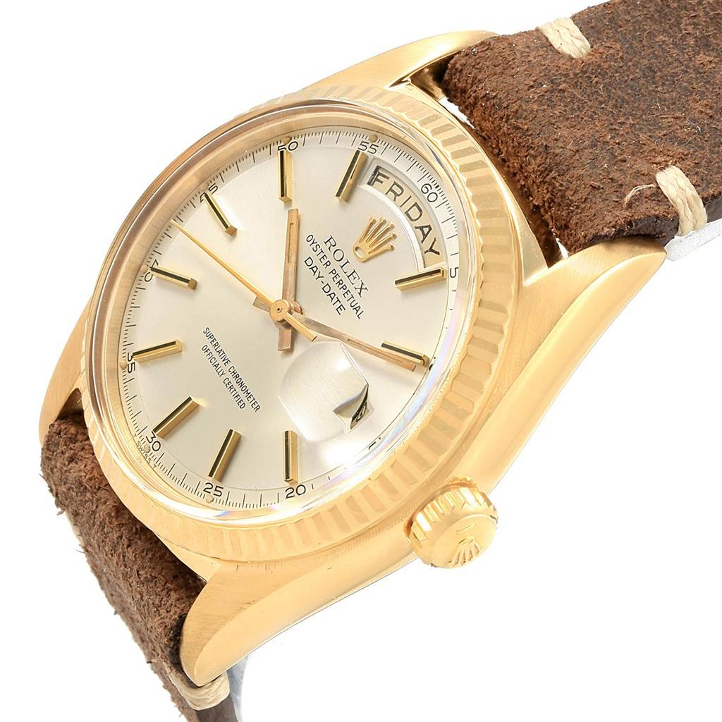 This image shows a Rolex Vintage Collection 1803 Men's Yellow Gold Silver Dial 1803 Men's Yellow Gold Silver Dial model watch at an angled view highlighting the dial, bezel, crown, and leather strap.