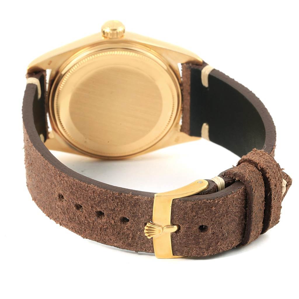 The image shows the back case and buckle of a Rolex Vintage Collection 1803 Men's Yellow Gold Silver Dial 1803 Men's Yellow Gold Silver Dial watch at an oblique angle.