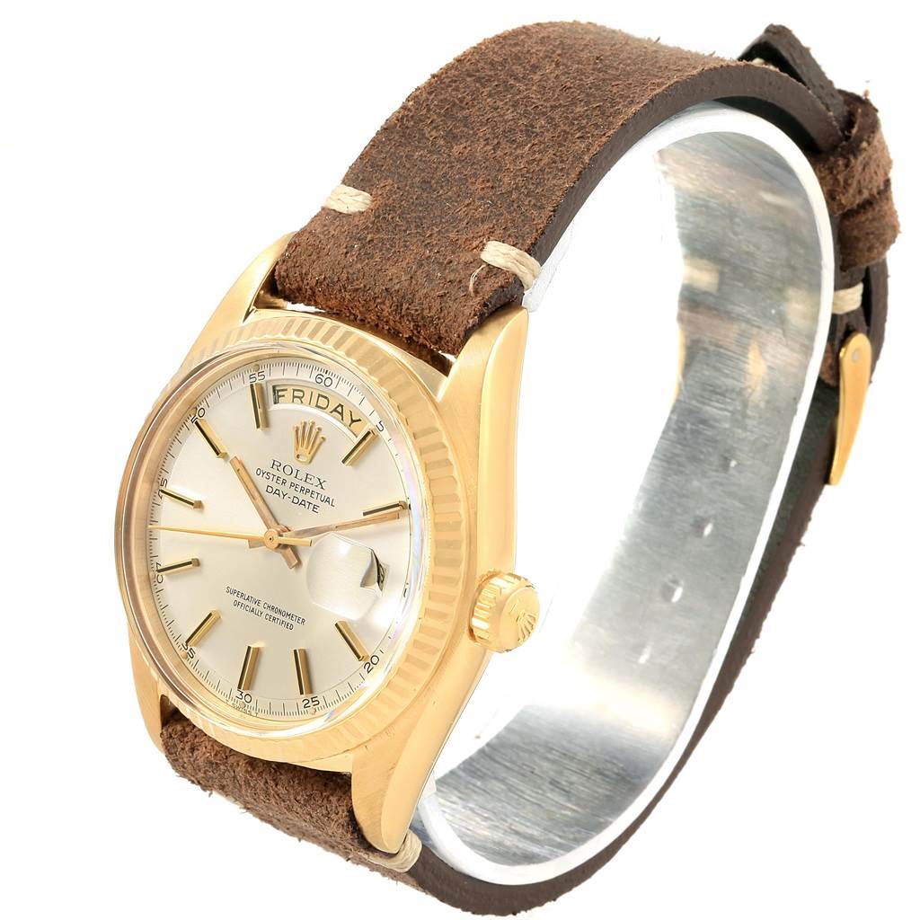 The image shows a Rolex Vintage Collection 1803 Men's Yellow Gold Silver Dial 1803 Men's Yellow Gold Silver Dial watch at a three-quarter angle, focusing on its gold case, dial, and brown leather strap.