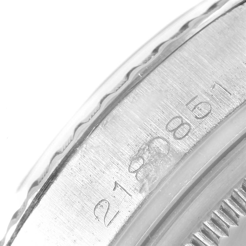 This image shows a close-up angle of the case side and engraved serial number on the Rolex Vintage Collection 1603 Men's Stainless Steel Black Dial 1603 Men's Stainless Steel Black Dial watch.