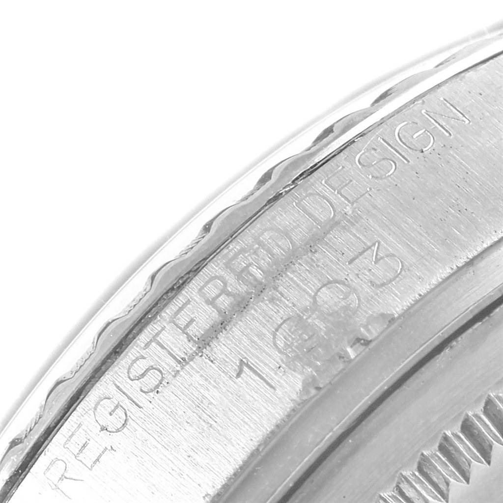This close-up image of the Rolex Vintage Collection 1603 Men's Stainless Steel Black Dial 1603 Men's Stainless Steel Black Dial model shows the inscription on the outer edge of the watch case.