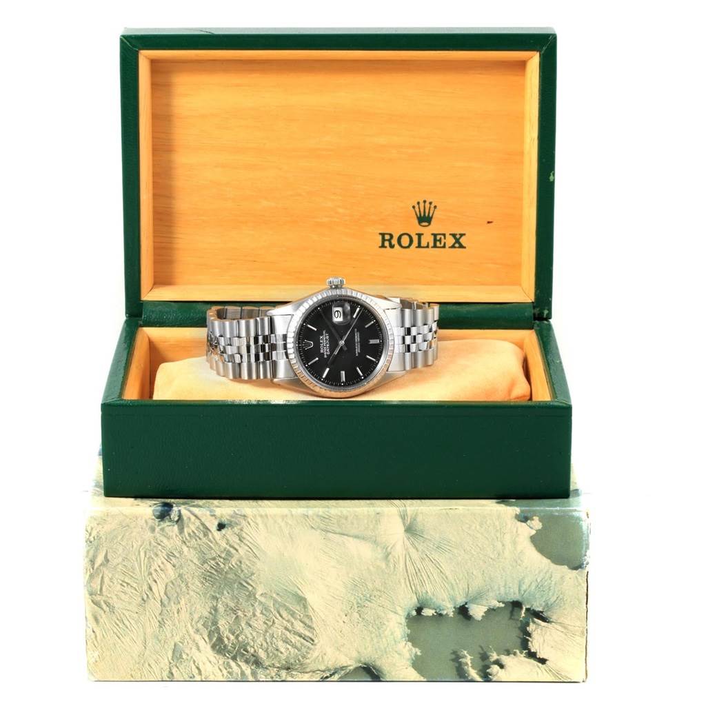 The Vintage Collection Rolex watch is displayed at a front angle, shown inside an open Rolex box.