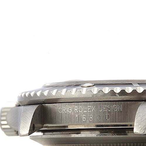 This image shows a close-up side view of the Vintage Collection model by Rolex, highlighting the bezel and "Orig Rolex Design 16800" engraving.