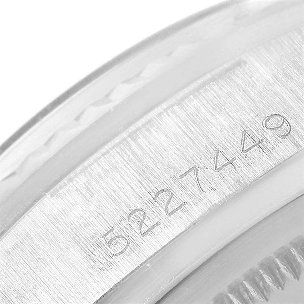 The image shows a close-up of the serial number engraving on the side of the Rolex Vintage Collection 1803 Men's White Gold Silver Dial 1803 Men's White Gold Silver Dial watch.
