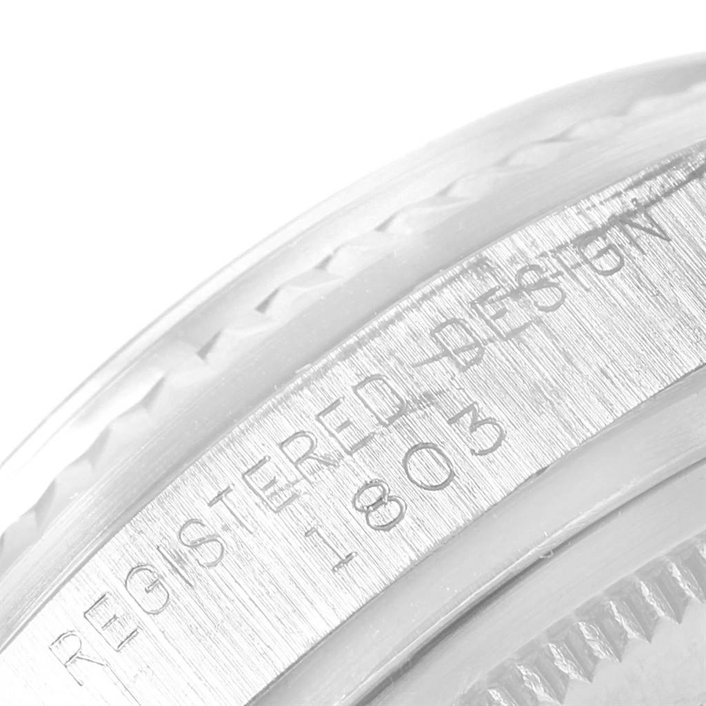 This close-up image shows the engraved bezel and case part of the Rolex Vintage Collection 1803 Men's White Gold Silver Dial 1803 Men's White Gold Silver Dial model watch.