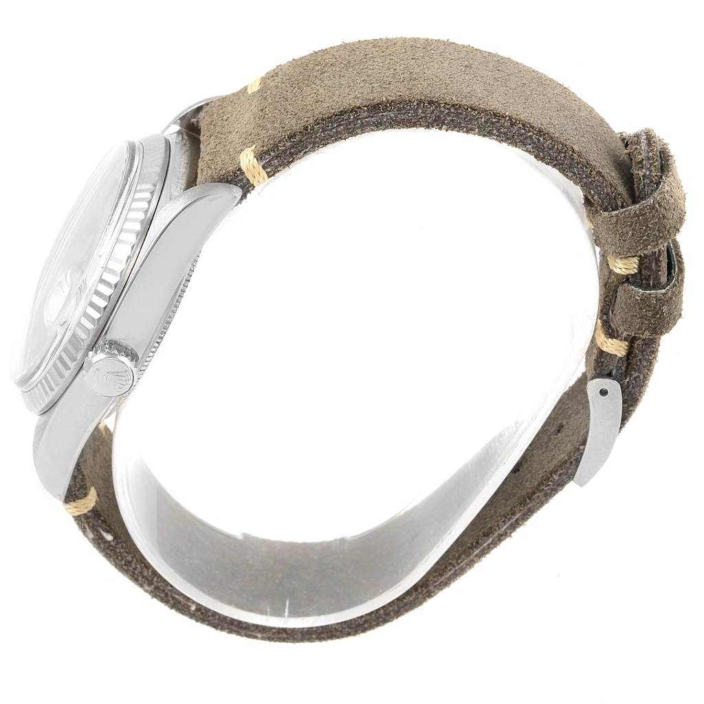 The image shows a side view of the Rolex Vintage Collection 1803 Men's White Gold Silver Dial 1803 Men's White Gold Silver Dial watch, highlighting its case, crown, and leather strap.