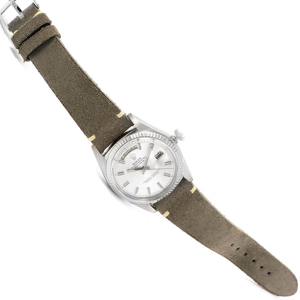 The Rolex Vintage Collection 1803 Men's White Gold Silver Dial 1803 Men's White Gold Silver Dial model is shown from a top-down angle, displaying the entire watch, including its face, crown, and leather strap.