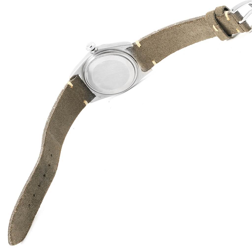 The image shows the backside of the Rolex Vintage Collection 1803 Men's White Gold Silver Dial 1803 Men's White Gold Silver Dial watch, highlighting its case back and leather strap.