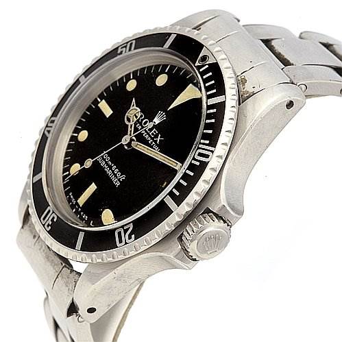 The image shows a Rolex Vintage Collection 5513 Men's Stainless Steel Black Dial 5513 Men's Stainless Steel Black Dial watch from an oblique side angle, highlighting the bezel, dial, and part of the metal strap.