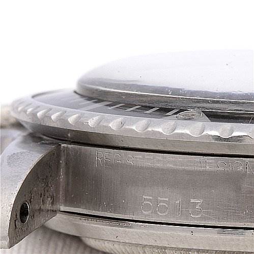 The image shows a close-up of the side of a Rolex Vintage Collection 5513 Men's Stainless Steel Black Dial 5513 Men's Stainless Steel Black Dial watch, highlighting its bezel, case, and engraved model number "5513."