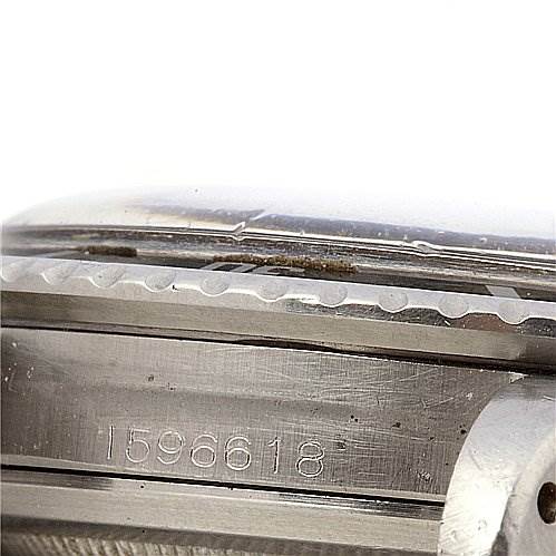 The image shows a close-up of the side of a Rolex Vintage Collection 5513 Men's Stainless Steel Black Dial 5513 Men's Stainless Steel Black Dial watch, including the serial number and part of the bezel.