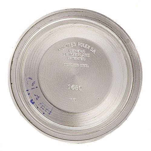 This image shows the inside case back of a Vintage Collection model Rolex watch, displaying its engraved details.