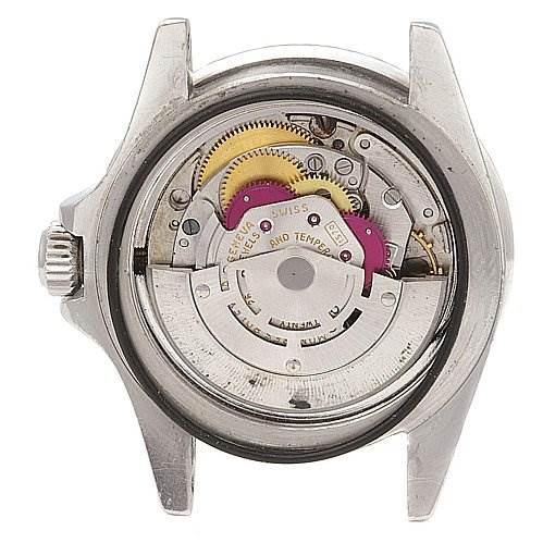 The image shows the internal mechanism of a Rolex Vintage Collection 1680 Men's Stainless Steel Black Dial 1680 Men's Stainless Steel Black Dial watch from a rear perspective, revealing gears and components.