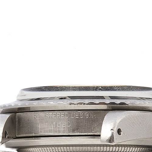 This image shows a side view of the Vintage Collection Rolex watch case focusing on the "REGISTERED DESIGN" engraving.